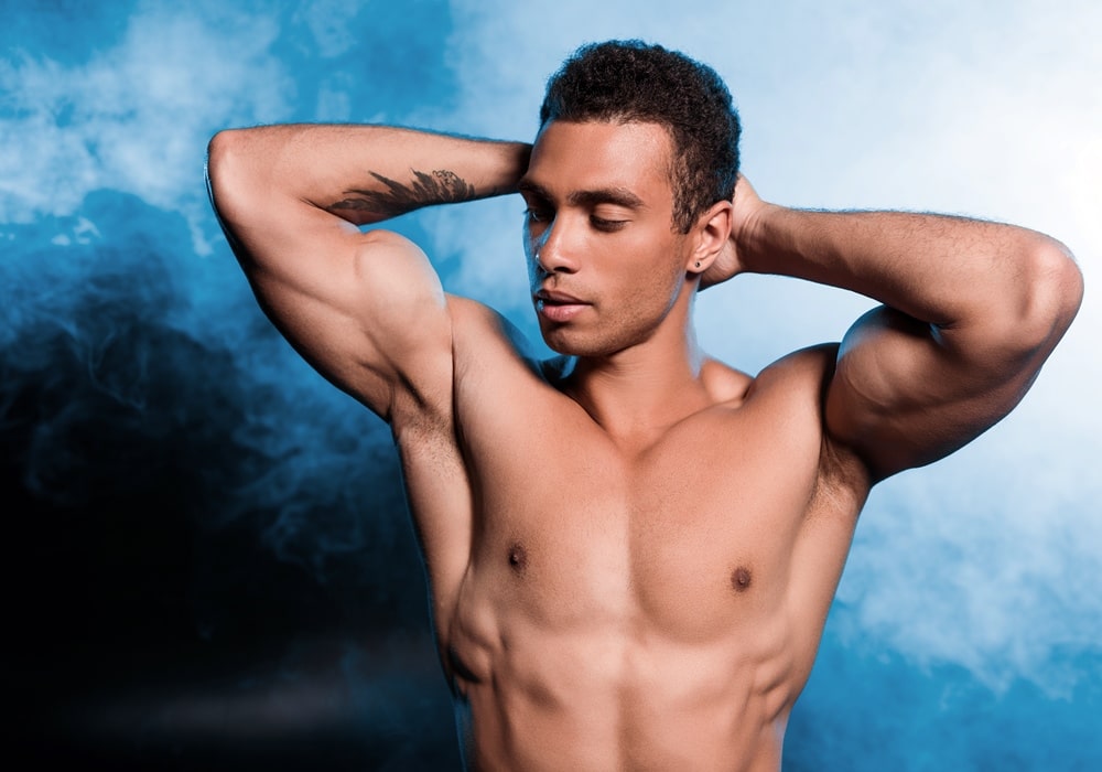 Bad Boy shirtless male stripper showing off his perfectly toned muscular body.