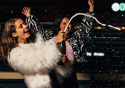 Bachelorettes Popping Champagne