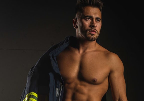 Shirtless Man Wearing a Firefighter Uniform